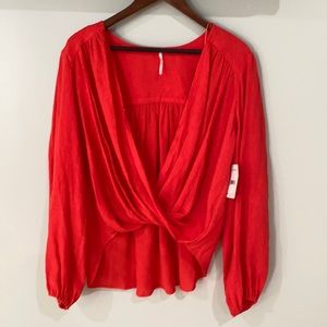 Red blouse in a size small.